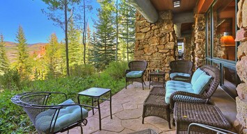 Relax on our scenic patio, featuring comfortable seating and beautiful forest views. Perfect for enjoying morning coffee or evening drinks in nature.