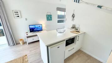 Microwave, stovetop, coffee/tea maker, toaster