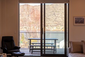 Smart TV, books - Stylish 2-BR Home, Scenic Balcony, Key Amenities (Queenstown)