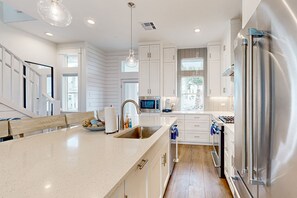 Fridge, microwave, oven, stovetop - Luxurious coastal retreat in Waters Edge, steps from beach, pool, and dining (Port Aransas)
