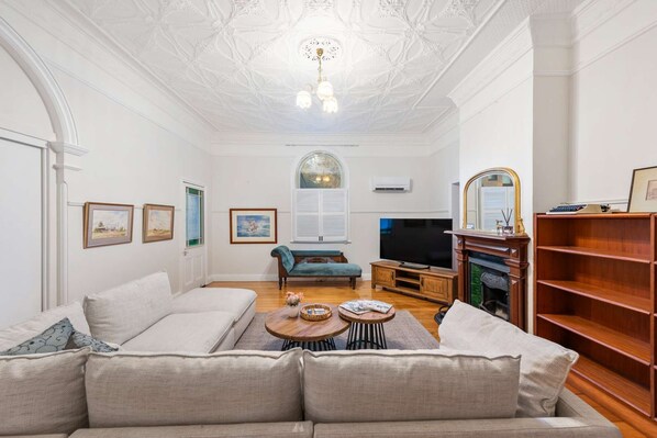 TV, fireplace, books