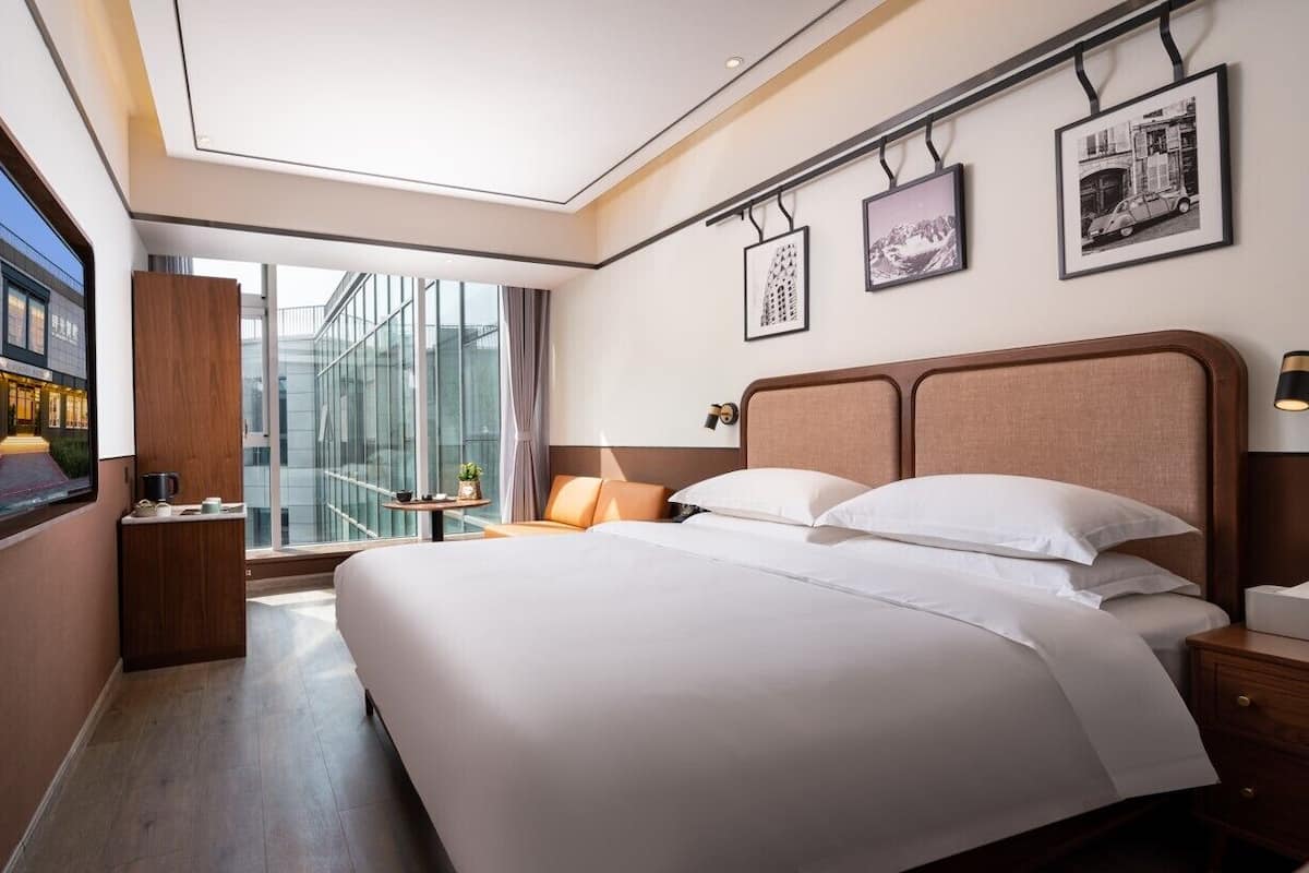Habitación doble estándar de uso individual | Camas con efecto memoria y artículos del minibar gratis