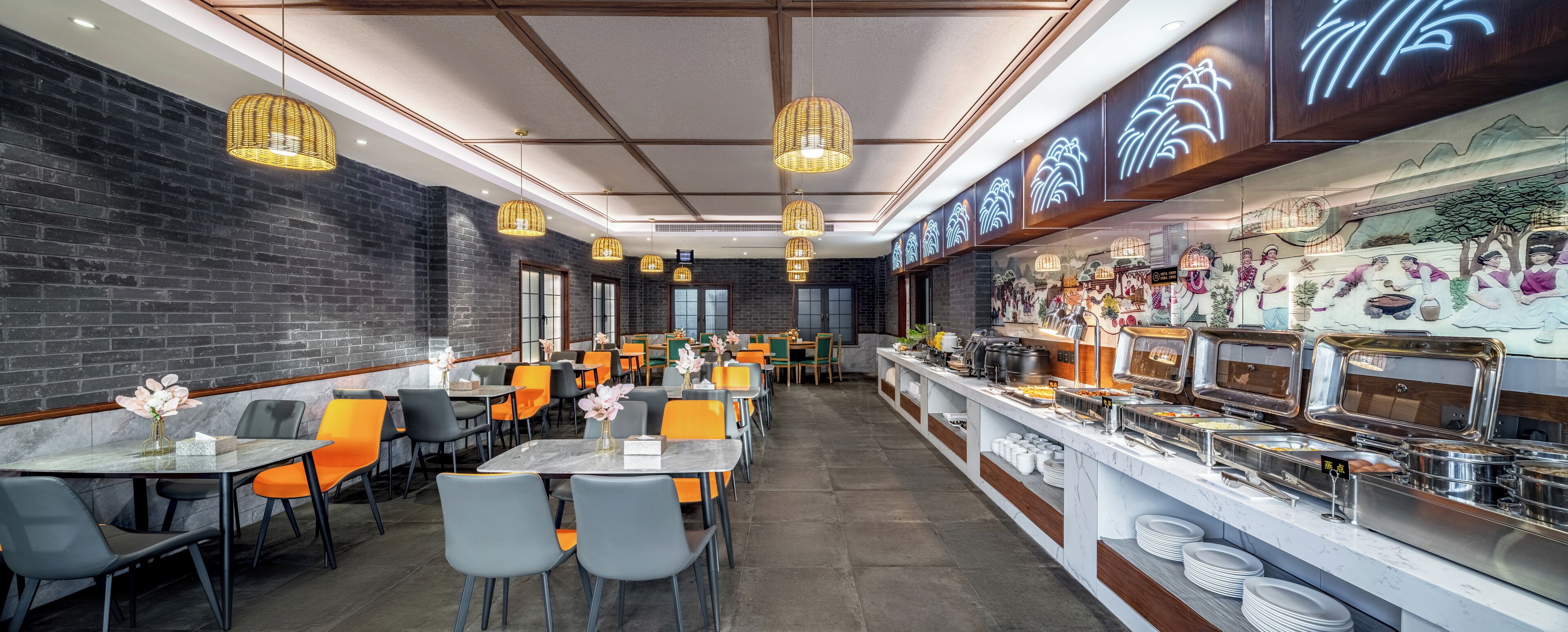 A restaurant with a brick wall, modern lighting, and a buffet area.
