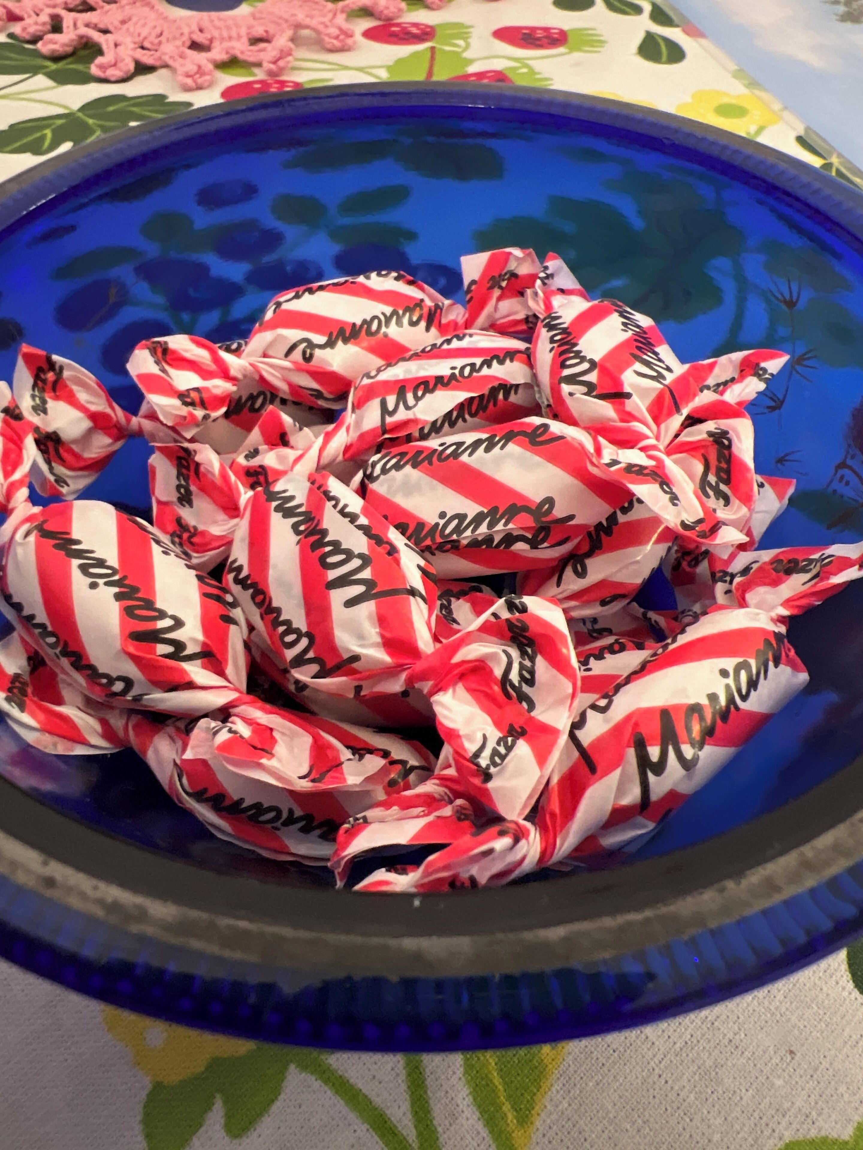 A bowl filled with wrapped candies labeled "Marianne."