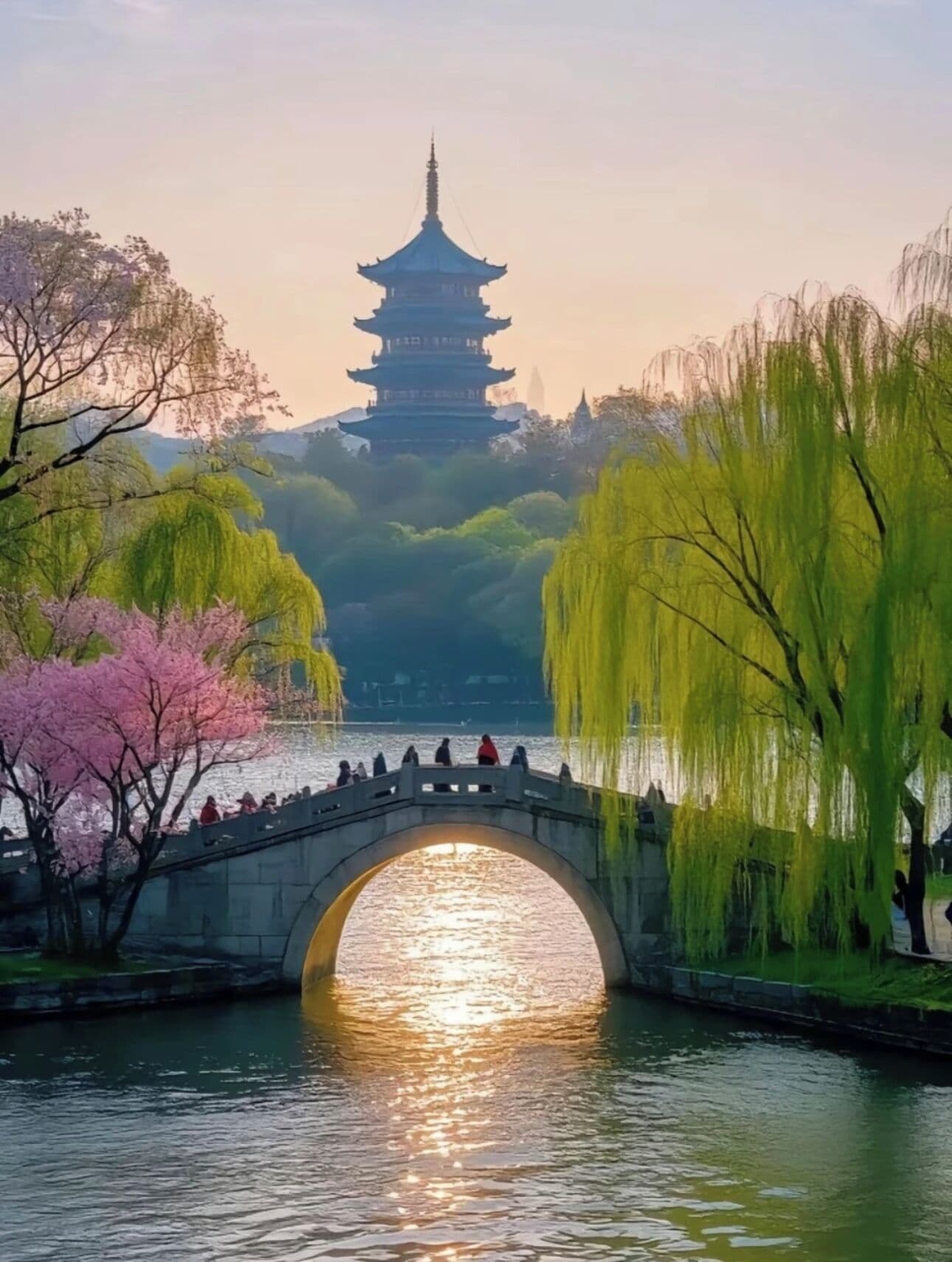 Un pont de pierre enjambant une rivière paisible, avec une pagode en arrière-plan.