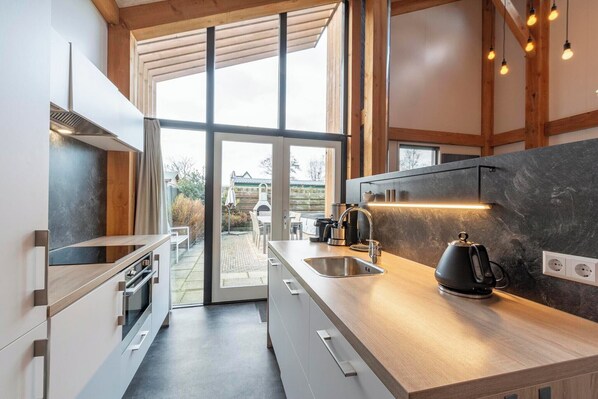 Fridge, stovetop, dishwasher, coffee/tea maker