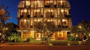 A multi-story building with a prominent sign reading "Boutik Cham Hotel". - Boutik Cham Hotel Nha Trang  (Nam Nha Trang)