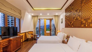 A hotel room with two beds, a TV, a wooden cabinet, and a balcony with a view. - Boutik Cham Hotel Nha Trang  (Nam Nha Trang)