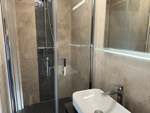 Shower, hair dryer, towels, soap