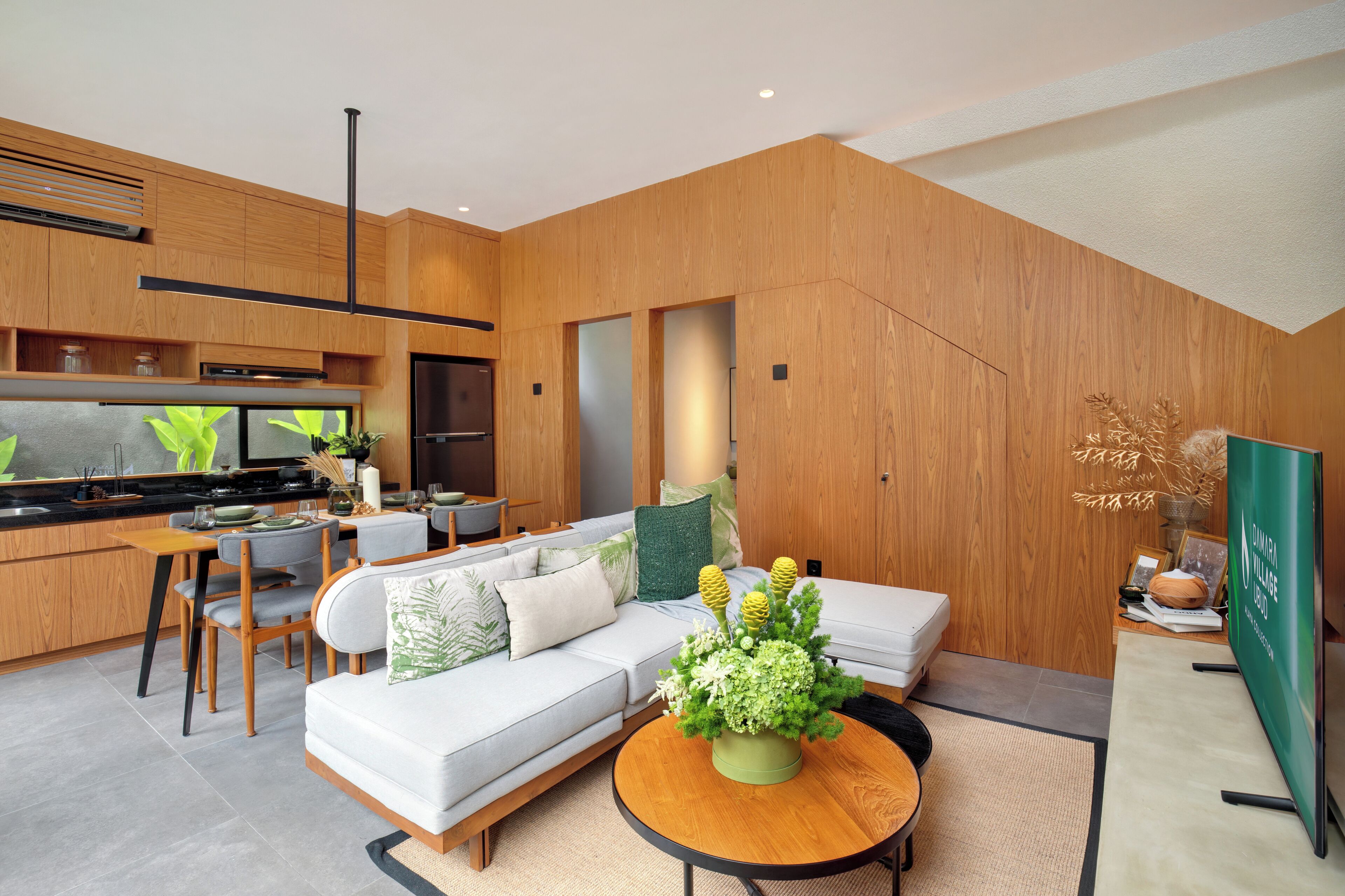 Un espacio habitable moderno con cocina, comedor y zona de estar.