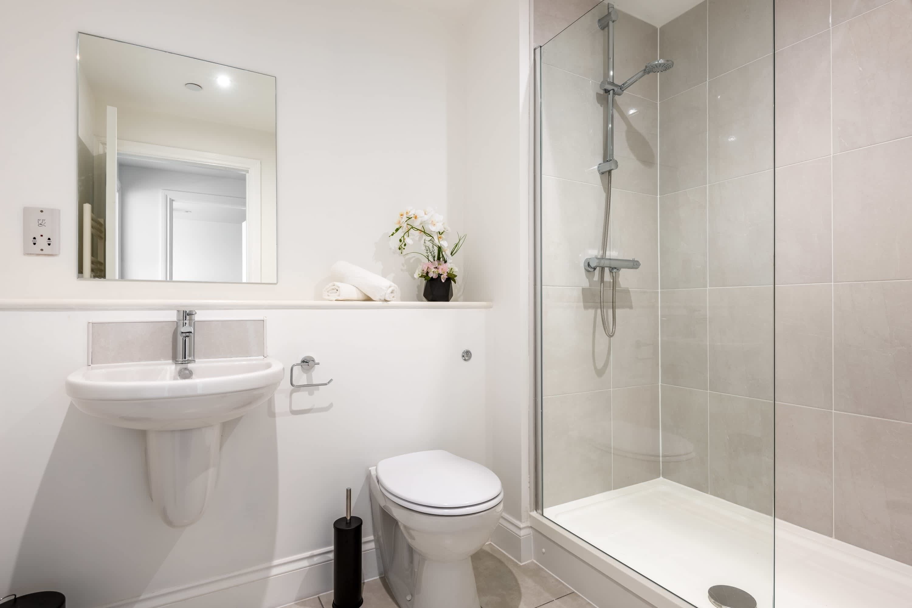 Shower, hair dryer, towels, shampoo