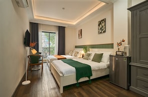 Family Room, 2 Queen Beds, Non Smoking, City View | Desk, soundproofing, free WiFi, bed sheets - The Passion Hotel Airport - 5 minutes to Tan Son Nhat (Ho Chi Minh City)