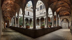 An interior courtyard with arches and columns, featuring a central open space surrounded by buildings. - La Nova Bed and Museum (Naples)