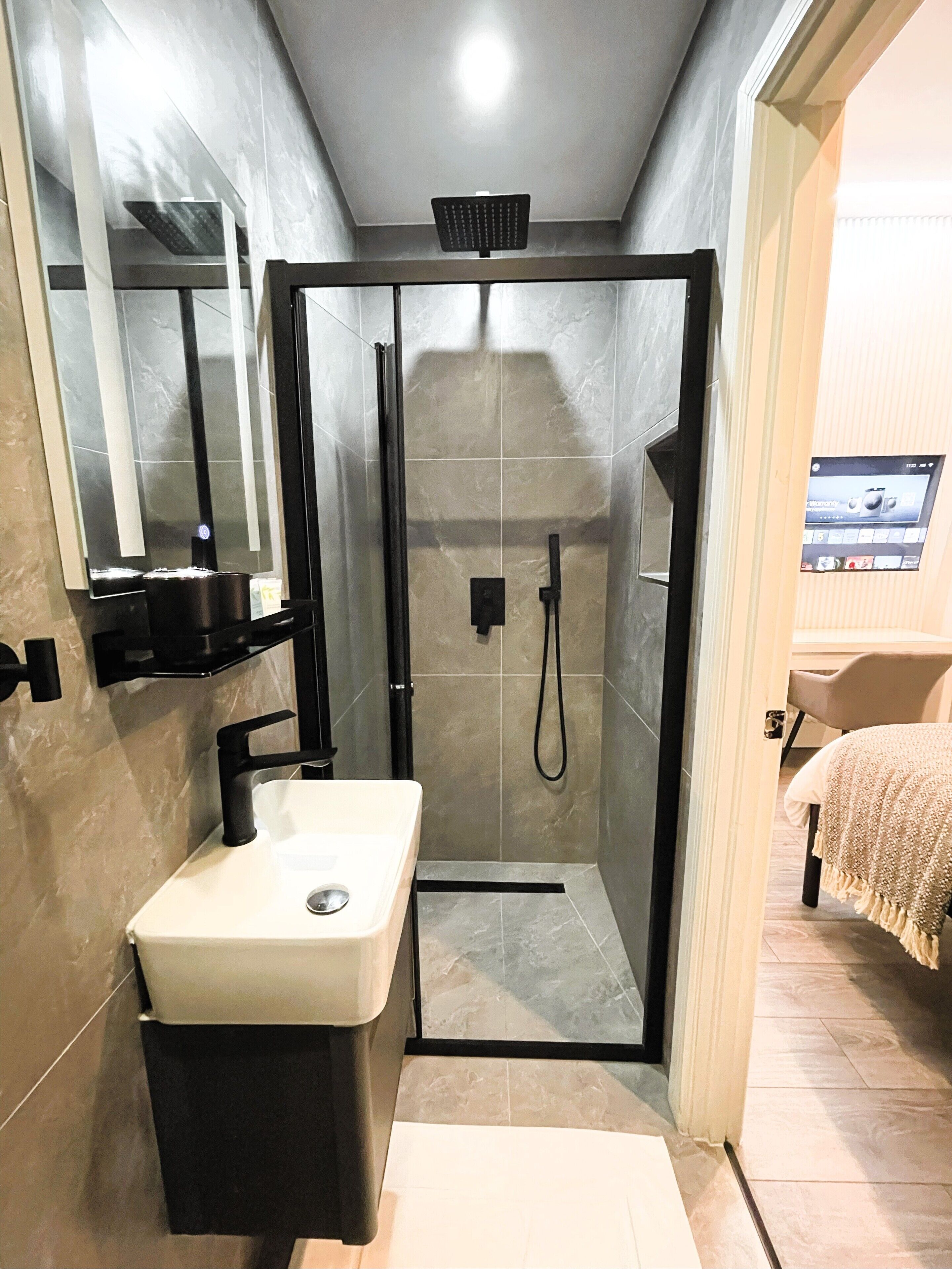 Shower, hair dryer, towels, soap