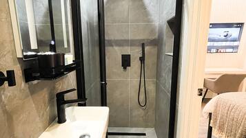 Shower, hair dryer, towels, soap