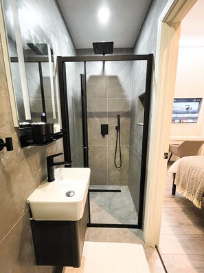 Shower, hair dryer, towels, soap