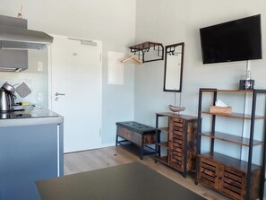 Deluxe Single Room, Non Smoking, Kitchen (7) | Living area - triple a Apartments in Altfeld (Marktheidenfeld)