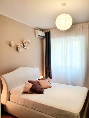 1 bedroom, desk, iron/ironing board, travel crib