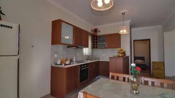 Apartamento conforto, vista para a cidade | Cozinha privada