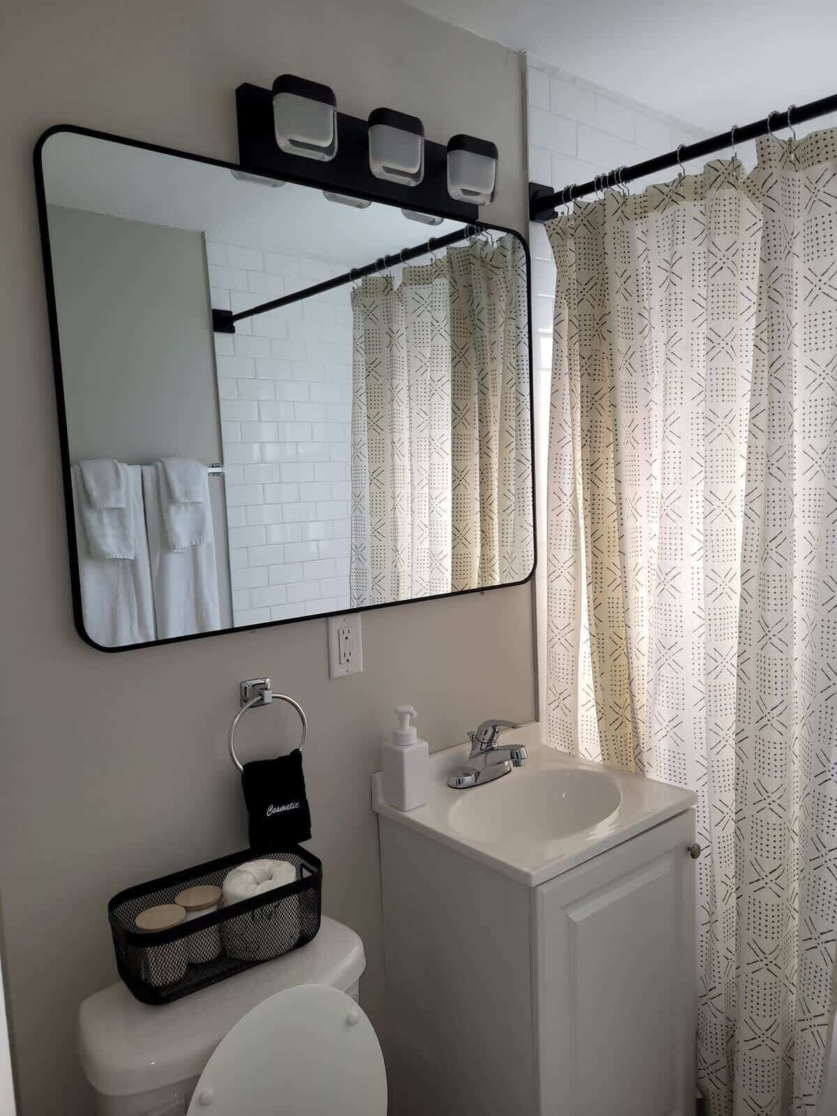 Shower, hair dryer, towels, shampoo