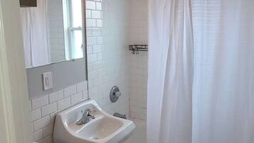 Shower, hair dryer, towels, shampoo