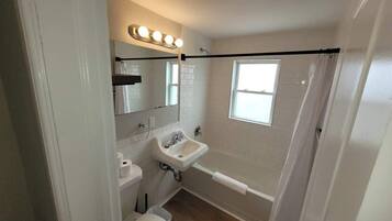 Shower, hair dryer, towels, shampoo