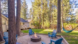 A backyard with a fire pit, outdoor seating, and a hammock. - Summer Retreat|5BR Stay Near Lake, Hikes~Water Fun (Big Bear Lake)