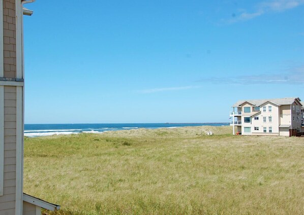 A beachfront property with a view of the ocean.