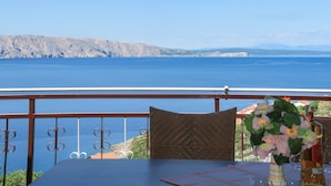 A table with a view of a large body of water and distant mountains. - Dalibor by Interhome (Senj)