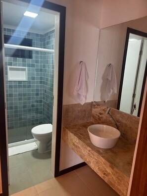 Shower, towels, soap, toilet paper