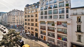 A multi-story building with a ground-floor entrance, large windows, and balconies. - WS Hôtel de Ville - Beaubourg (Paris)