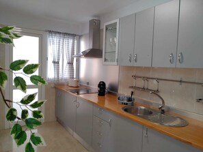 Fridge, microwave, stovetop, coffee/tea maker