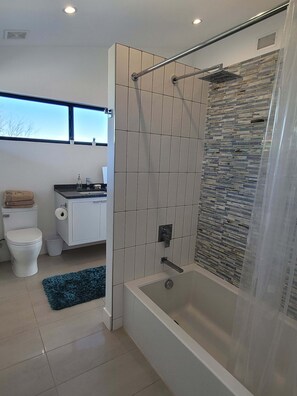 Shower, hair dryer, towels, soap