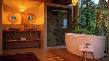 Separate tub and shower, towels, soap, shampoo