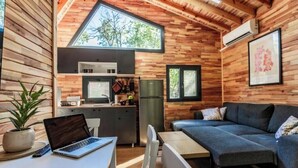 A compact living space with a kitchenette, a dining area, and a seating area. - Lion's Forest #4 (Burgas)