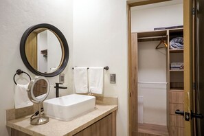 A bathroom with a white sink, two mirrors, and a towel rack. - Charming Home Near San Miguel Main Plaza (San Miguel de Allende)