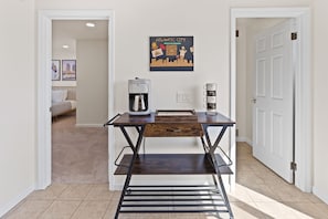 Relax in a clean and uncluttered space with a comfortable bed and convenient coffee maker.