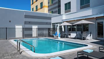 Outdoor pool, open 9:00 AM to 11:00 PM, pool umbrellas