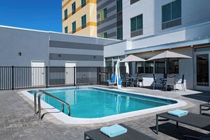 Outdoor pool, open 9:00 AM to 11:00 PM, pool umbrellas