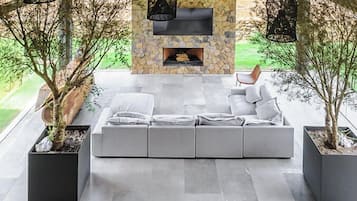 Premium House | Living area | 50-inch flat-screen TV with digital channels, fireplace