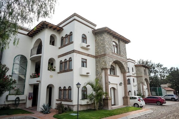 Traditional architecture meets serene surroundings in this charming two-story building.