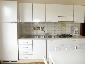 Fridge, microwave, high chair, cookware/dishes/utensils