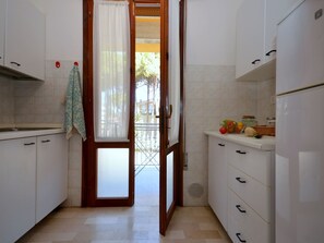 Fridge, microwave, high chair, cookware/dishes/utensils