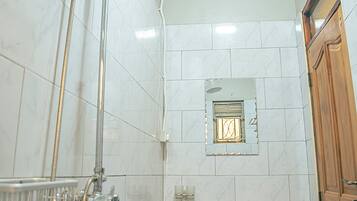 Shower, slippers, towels, soap