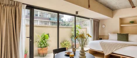 Deluxe Apartment, Patio | Minibar, in-room safe, desk, laptop workspace