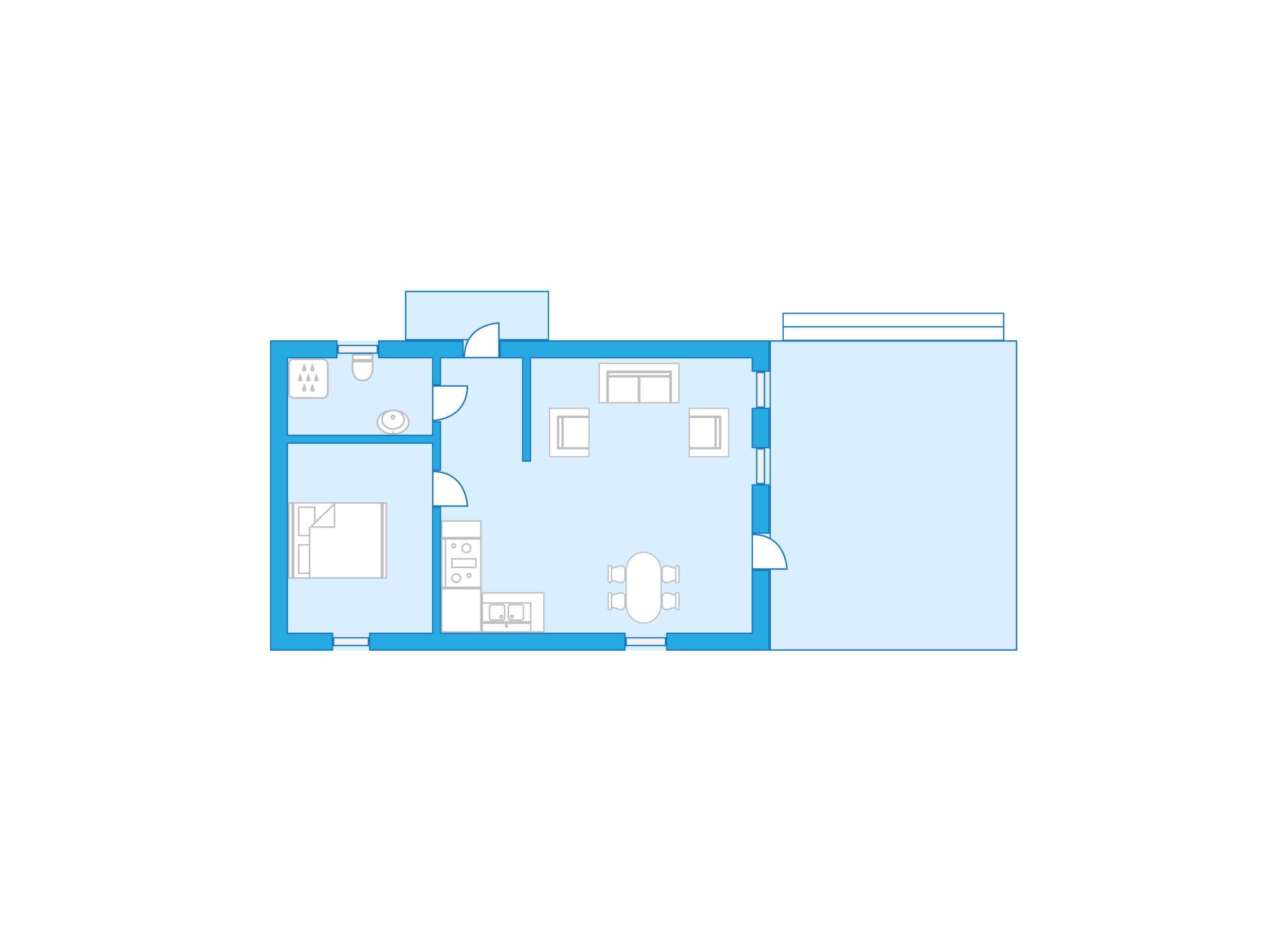 Un plan d’étage d’une chambre d’hôtel comprenant un coin cuisine, un espace repas et une salle de bain séparée.