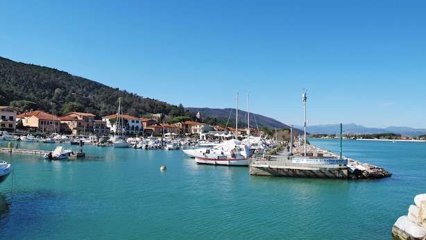 A marina with boats docked, a pier, and buildings in the background. - Apartment Italia by Interhome (Bocca di Magra)