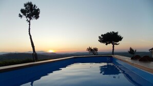 A swimming pool with a sunset view, surrounded by trees and a hilly landscape. - Masseria Difesa Grande by Interhome (Montenero di Bisaccia)