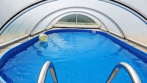 A clear view of a swimming pool with a diving board and a ball. - Pool & Wellness Estate by Interhome (Destne v Orlickych Horach)