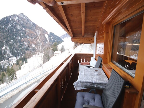 A wooden cabin with a balcony overlooking a snowy mountain landscape. - Piz Munschuns by Interhome (Spiss-Samnaun)